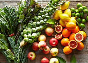 a group of fruits and vegetables on a wood surface Healthy Weight Loss Diets Kingshurst