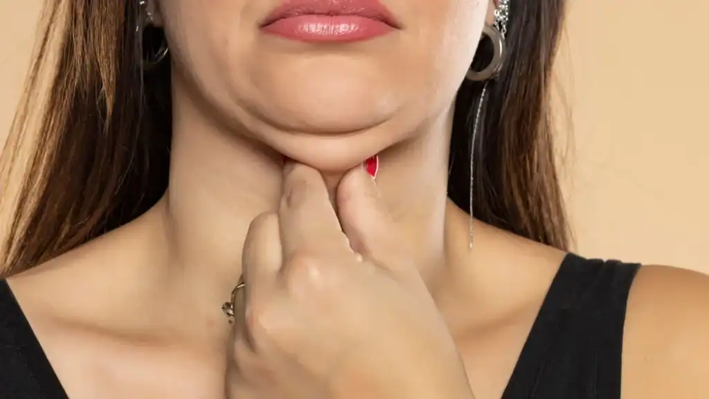 An image of a woman with double chin, sad, worried : Non Surgical Double Chin Removal Treatment in Kingshurst, UK